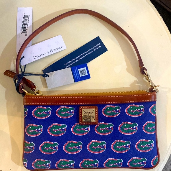 Selling brand new, never used Florida Gators, Dooney & Bourke wristlet/wallet. - Picture 1 of 4